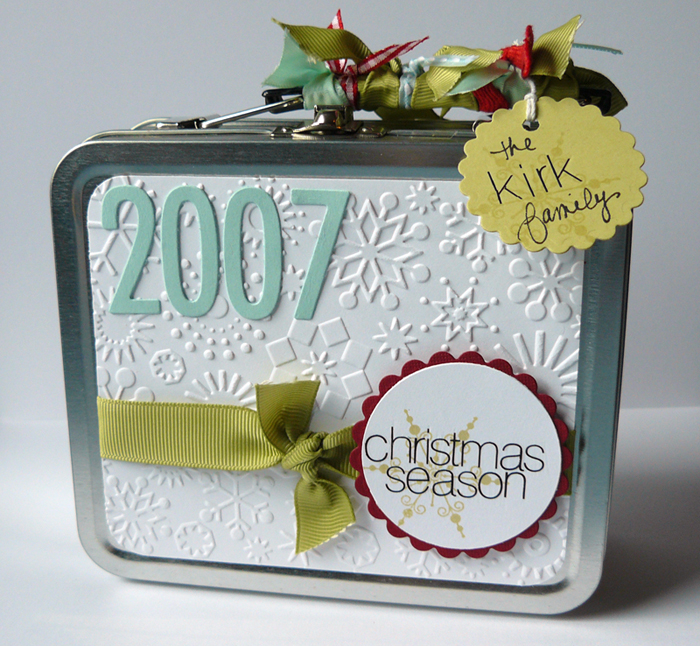 I used a Maya Road lunchbox tin to hold the Christmas album.  Papertrey items used include the...