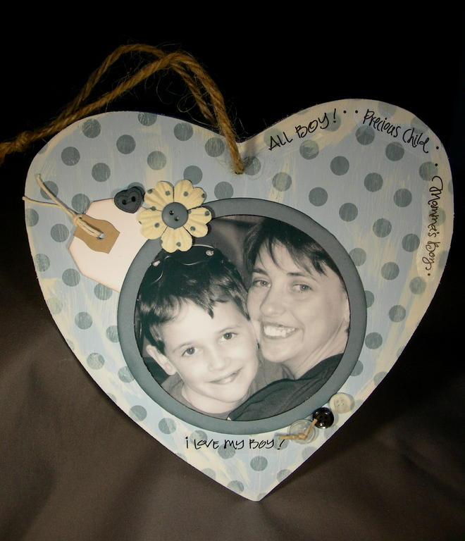 I made this with a $1.00 wooden heart, painted it with acrylic paint, stamped the medium size...