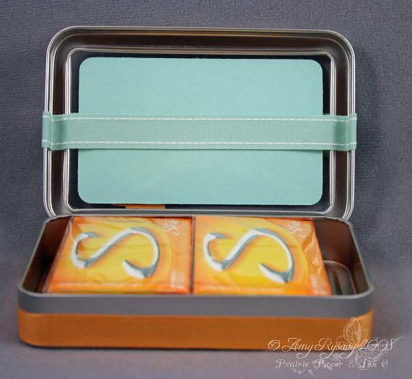 I wrapped the ribbon around just the lid (it still opens and closes easily) attaching it with...