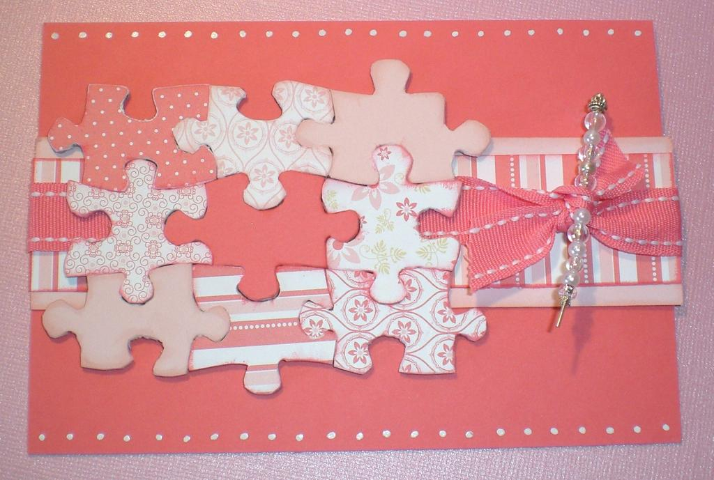 I covered puzzle pieces with the patterned paper