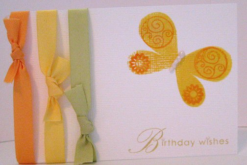 This card features 3 twills tied in simply knots. I should have re stamped the butterfly because...