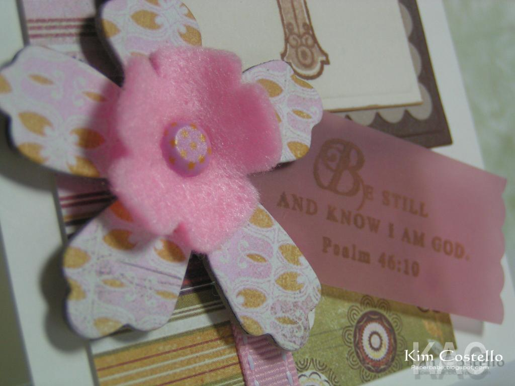 Felt flower layered over chipbord flower holding sentiment on vellum.<br />
Materials: Paper:...