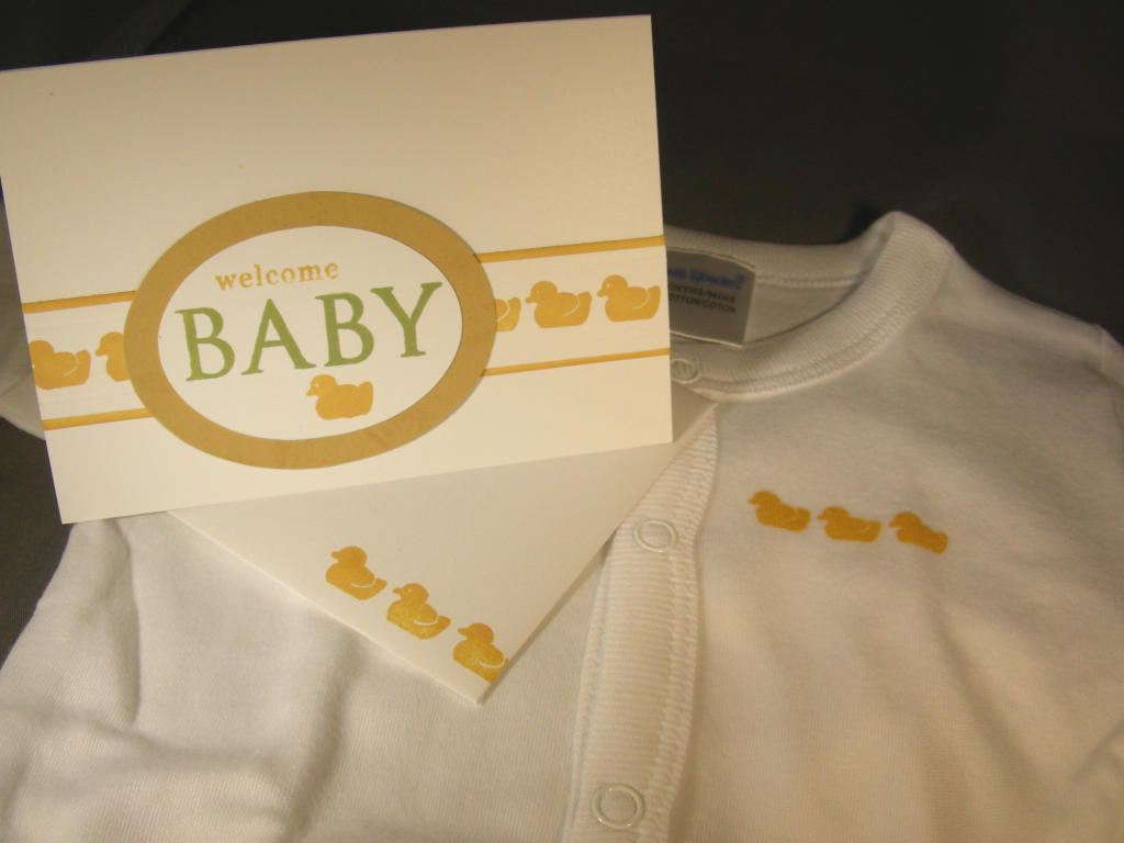 Made this for a friend.  My first try at stamping on cloth - the little onsie.  Used that cute...