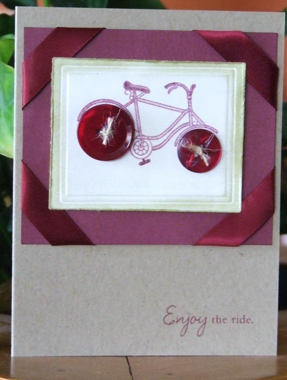 PTI Kraft and white cardstock.  Scarlet Jewel ink, ribbon and buttons.  Everyday button bits...