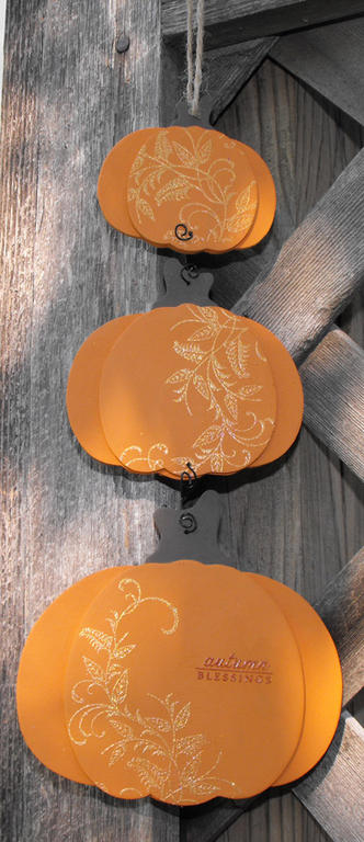 I got this cute trio of pumkins made of raw balsa wood last fall on clearance.  I painted them...