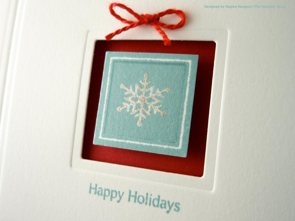 I created a cut-out frame nestled within a succession of embossed squares with a tiny red bow to...