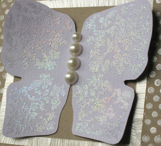 The clear sparkle embossing powder looks brilliant when the light catches it.