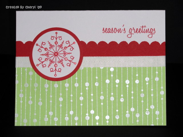 I heat embossed the background in white, stamped and punched the snowflake, added a little...