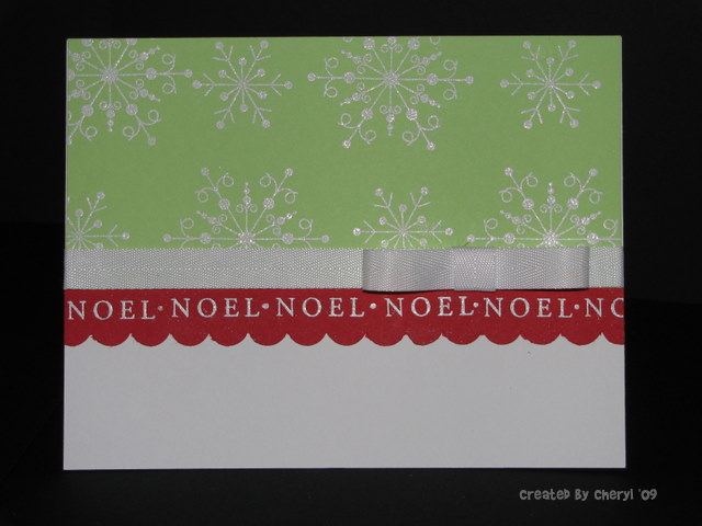 I heat embossed the snowflakes in white on the green.  I decided to repeat the sentiment on the...
