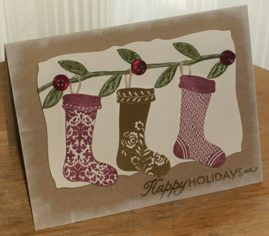 I wanted to create a card where the stockings were hanging from a garland with berries so I...
