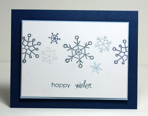 clean &amp; simple holiday card<br />
I stamped the snowflakes, then stamped with the glue pad...