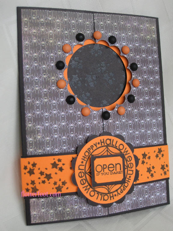 Interactive card card with a magic window using Basic Grey patterened paper, orange and black...