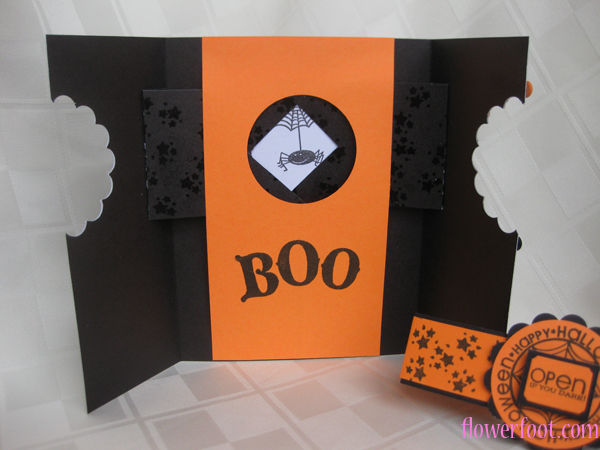 Interactive card card with a magic window using Basic Grey patterened paper, orange and black...