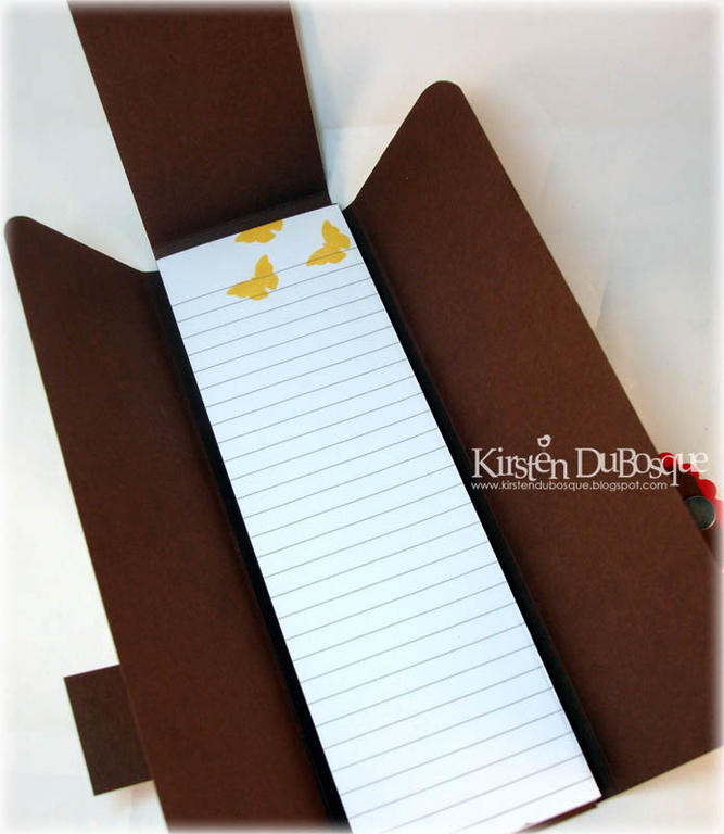 All flaps are open to reveal stamped note pad.