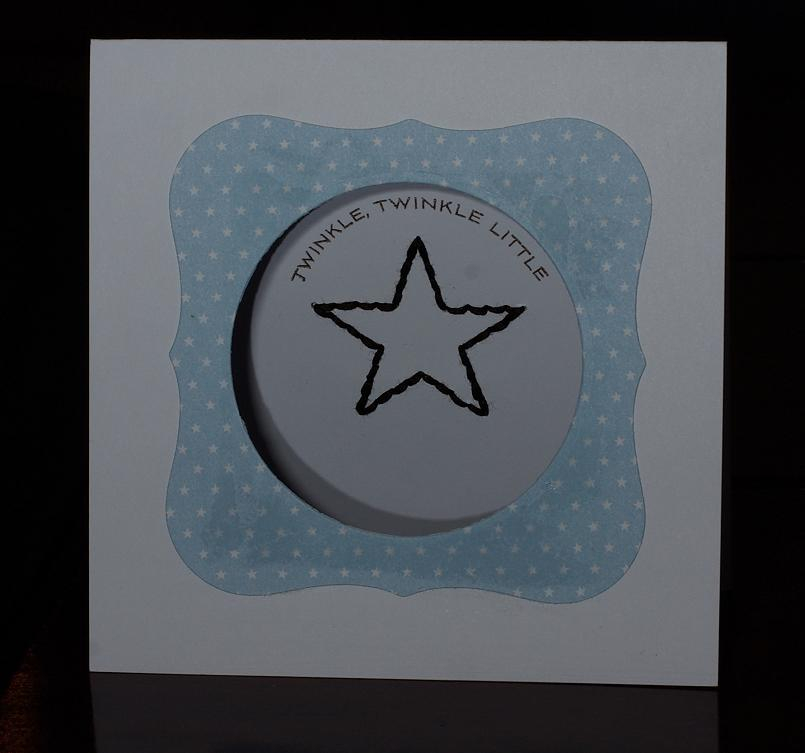 The star is hand-stitched on the inside of the card, see second picture for flat view. Kinda...