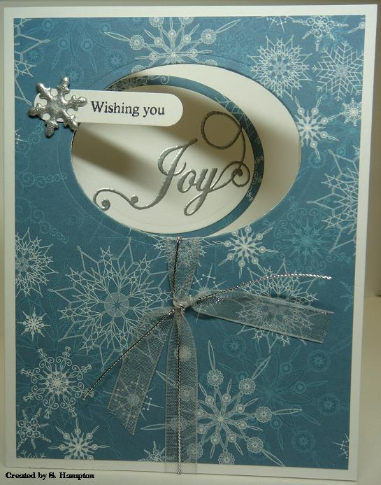 I used my Nestibilities to cut the ovals. The snowflake brad was originally white so I embossed...