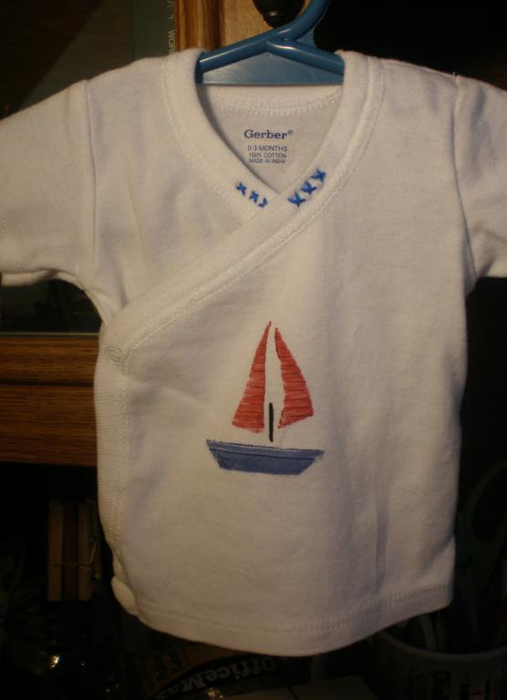 I made this little shirt for one of my cousins, who is expecting a boy in June. I used the Men...