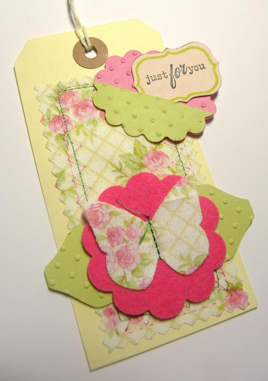 Fabric sewn tag using matstack die and butterfly die and raspberry fizz felt.