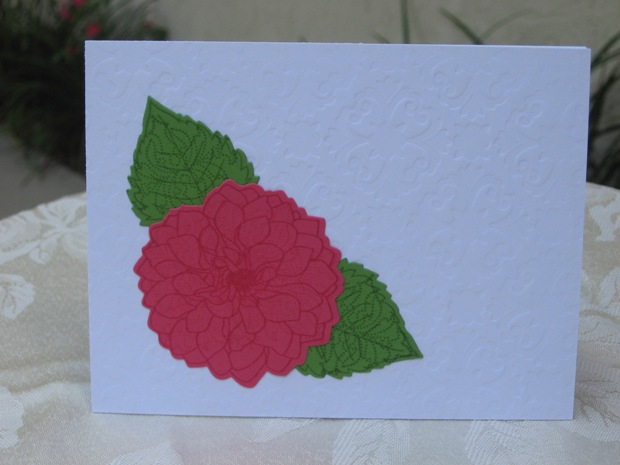 Delightful Dahlia flower and leaves, overstamped with a dotted stamp by SU.  The background is...