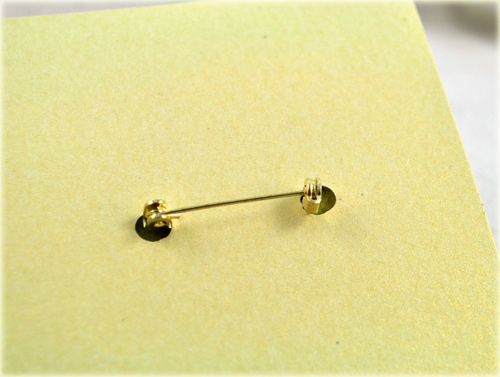 This is the inside of the card where two 1/4" holes let the pin back mechanism stick...