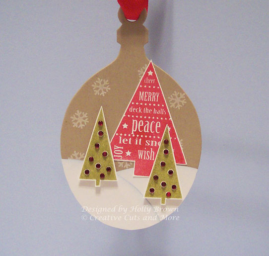 I used a die cut ornament and created a Christmas tree scene.  I wanted a rustic country feel...