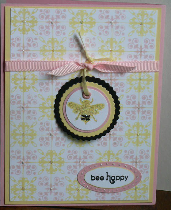 I like the yellow and blush blossom together. Much more in love with the background than the bee...