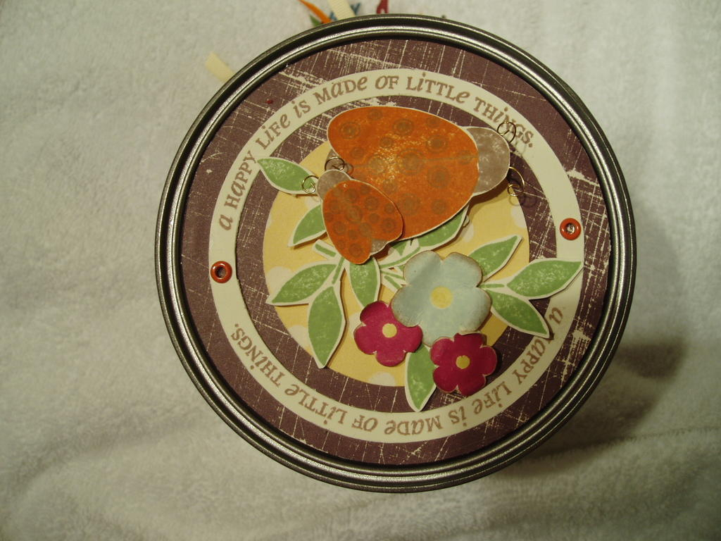 Top of a paint can, which held the baby onsie gift.  Used Little Lady for the top of the can.