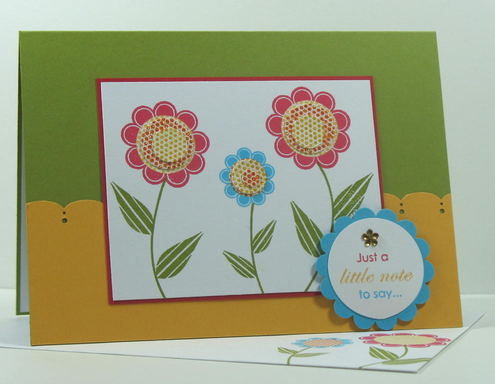 I used graduate punches to make custom flower centers and added Stickles to all the little dots....