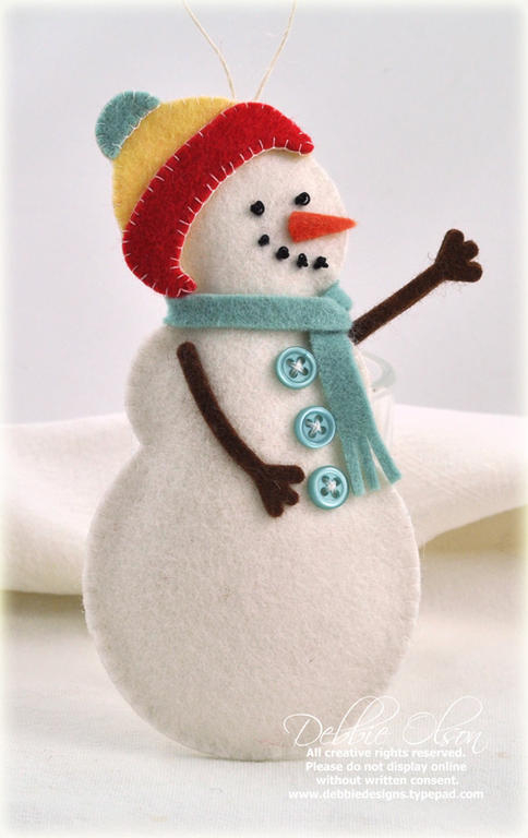 Stamps: None, but I used the Shape Up Snowman dies for this felt ornament.<br />
Accessories:...