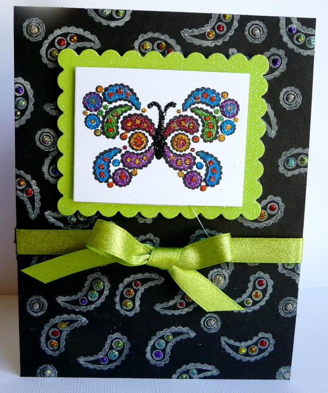 Butterfly Kisses stamp set.  I stamped the image in black and then painstakingly added glitter...
