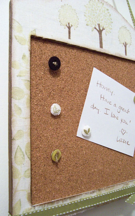 The push pins are decorated with leaf images from Father Knows Best and vintage buttons tied...