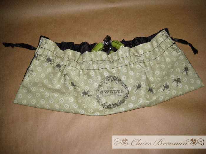 I used co-ordinating fabric to line the cloak. This enabled me to make it into a bag which would...