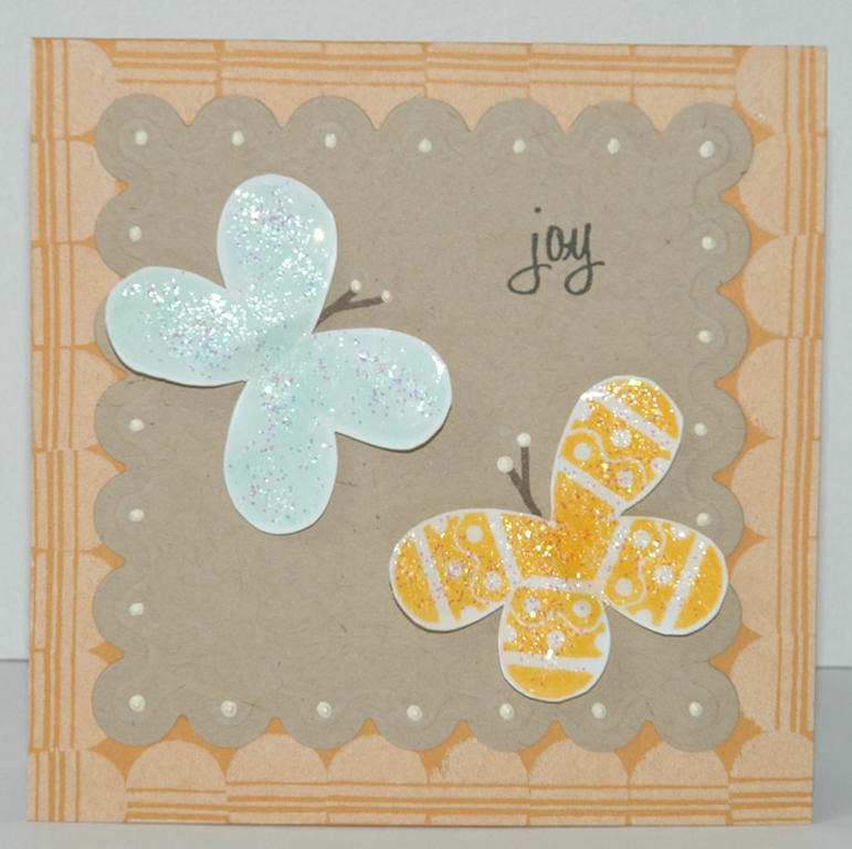 I used an ornament to create these two butterflies. I stamped 4 times, then I cut out the...