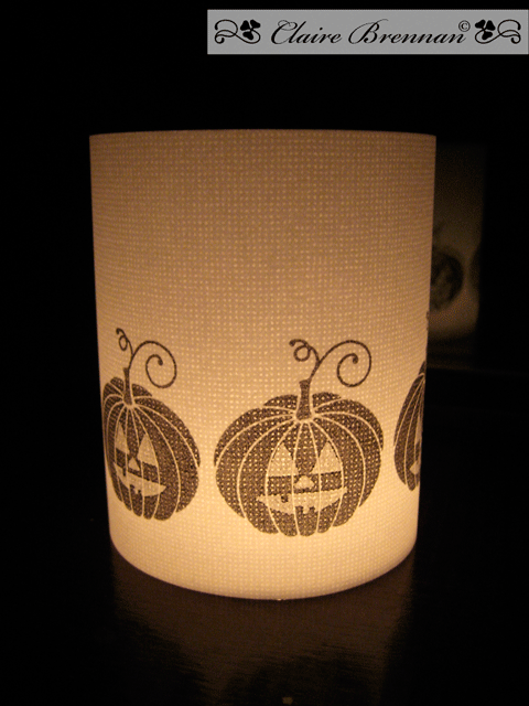 The pumpkin faces were stamped in versamark - clear embossed so they would resist the black ink...