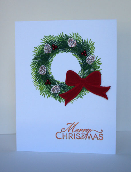 I created the wreath by stamping one of the branches/boughs from Bells &amp; Boughs in two...