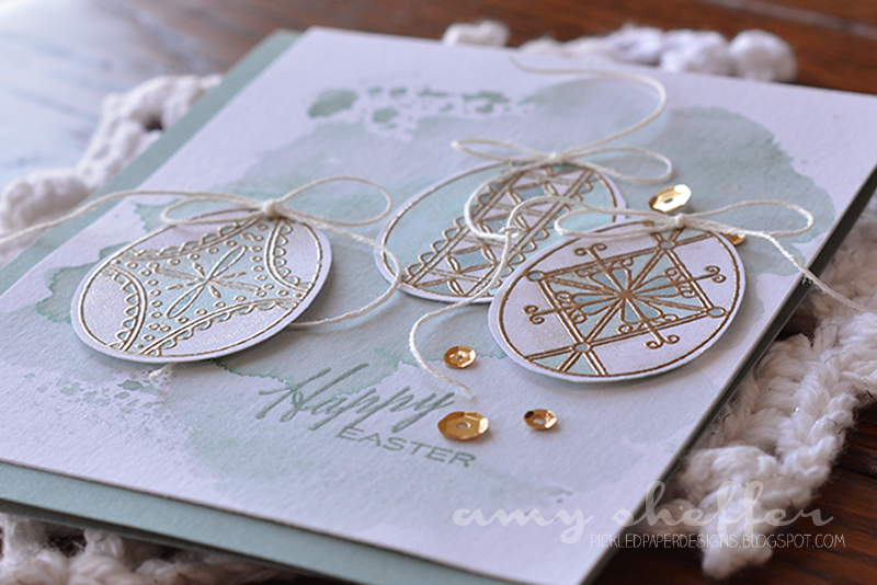 Stamps: Etched Easter Eggs<br />
Ink: VersaMark, Ocean Tides<br />
Paper: 140-pound watercolor...