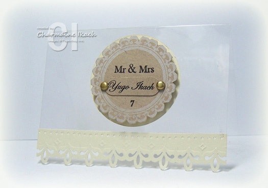 This is a wedding place card made out of a transparency.  The focal point is made to look like a...
