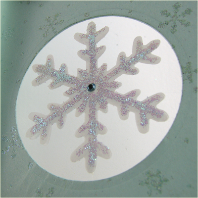 I used a mono-filament  clear thread to suspend the vellum snowflake between the mat layer and...
