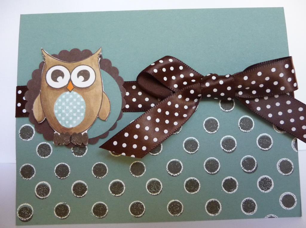 Ocean tides cardstock stamped with polkadot basics in chocolate.  stamped again in versamark and...