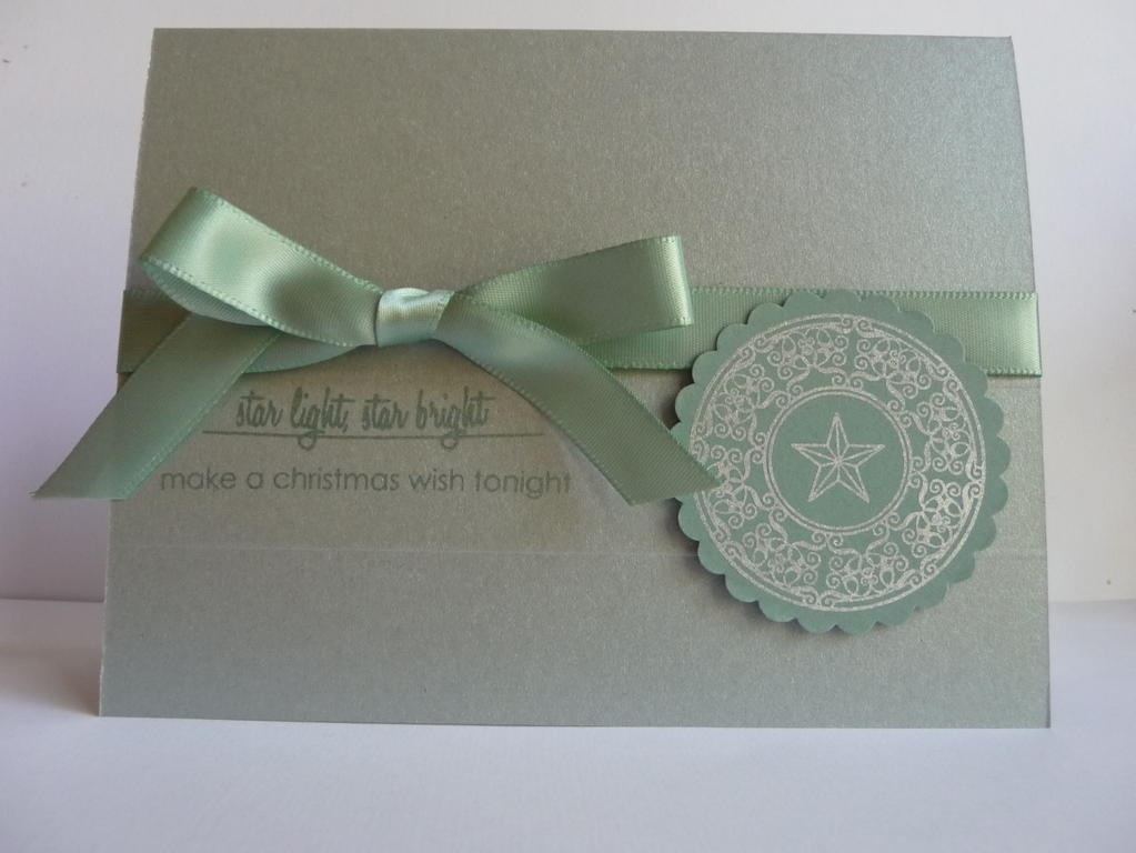 Simple Christmas Card using PTI silver cardstock and ocean tides.  Stamped with encore silver...