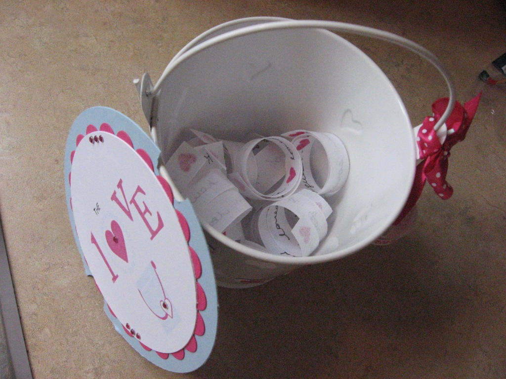 The Love Bucket, all nice things written on vellum with stamped hearts. Like "Make your...
