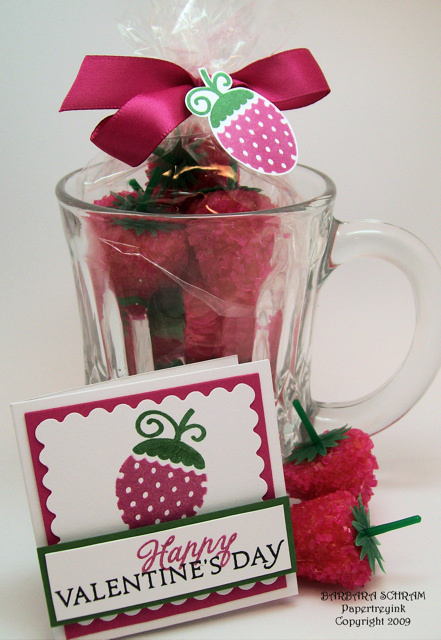 Coconut Strawberry no bake cookie treats rolled in sparkle sugar fill the glass mug. Plastic...