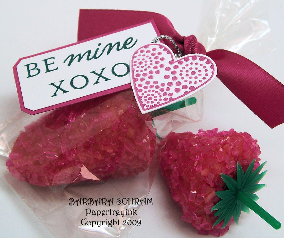 XOXO no bake coconut strawberry cookie treat inserted into a shortened pretzel rod cello bag....