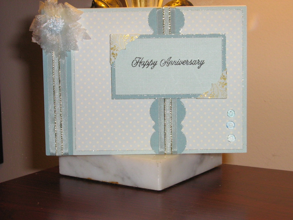 Ack! I just found the strip of ribbon! In my haste to submit my card, I forgot to add this...