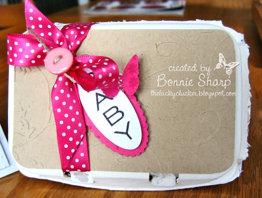 This is a half dozen egg carton done up with baby socks inside. See next picture for the sock tags!