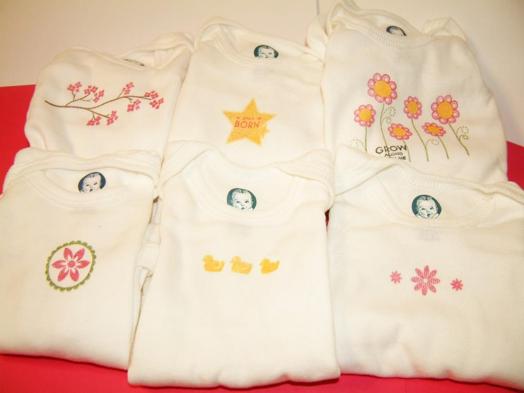 I stamped on 6 onsies (3 newborn and 3 0-3 mo.) using PTI stamps and Palette Ink<br />
<br />...