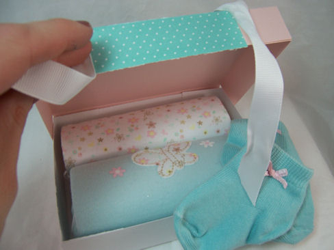 butterfly baby inside<br />
<br />
This is perfect for enclosing those adoable baby gift! I...