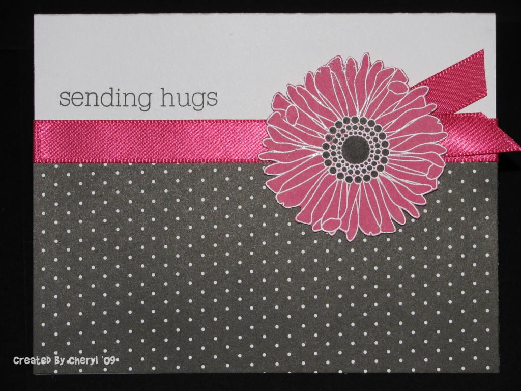 I heat embossed the flower on Raspberry Fizz paper, colored in the center with black marker, and...