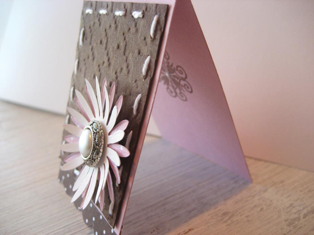 Detail shot to illustrate the 3-D effect of the layered paper daisy popped up on foam and a peak...