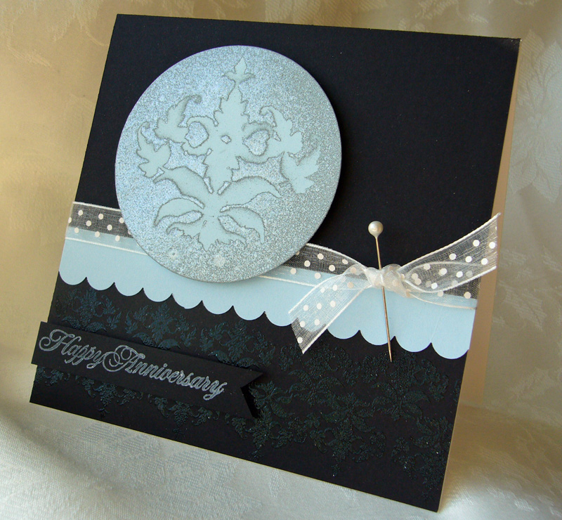 I made a mask out of the main image in Damask Designs...a lot of cutting!  I placed the mask on...